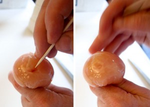If there are large air bubbles in the ball you can poke them with a skewer and they will go away.  If you poke the wrap with a skewer you'll need a second layer of plastic.