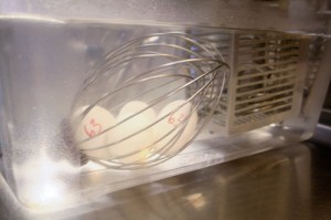 Eggs are one of the few foods that we circulate directly in water.  The whisk is just to keep them from rattling around in the circulated bath.